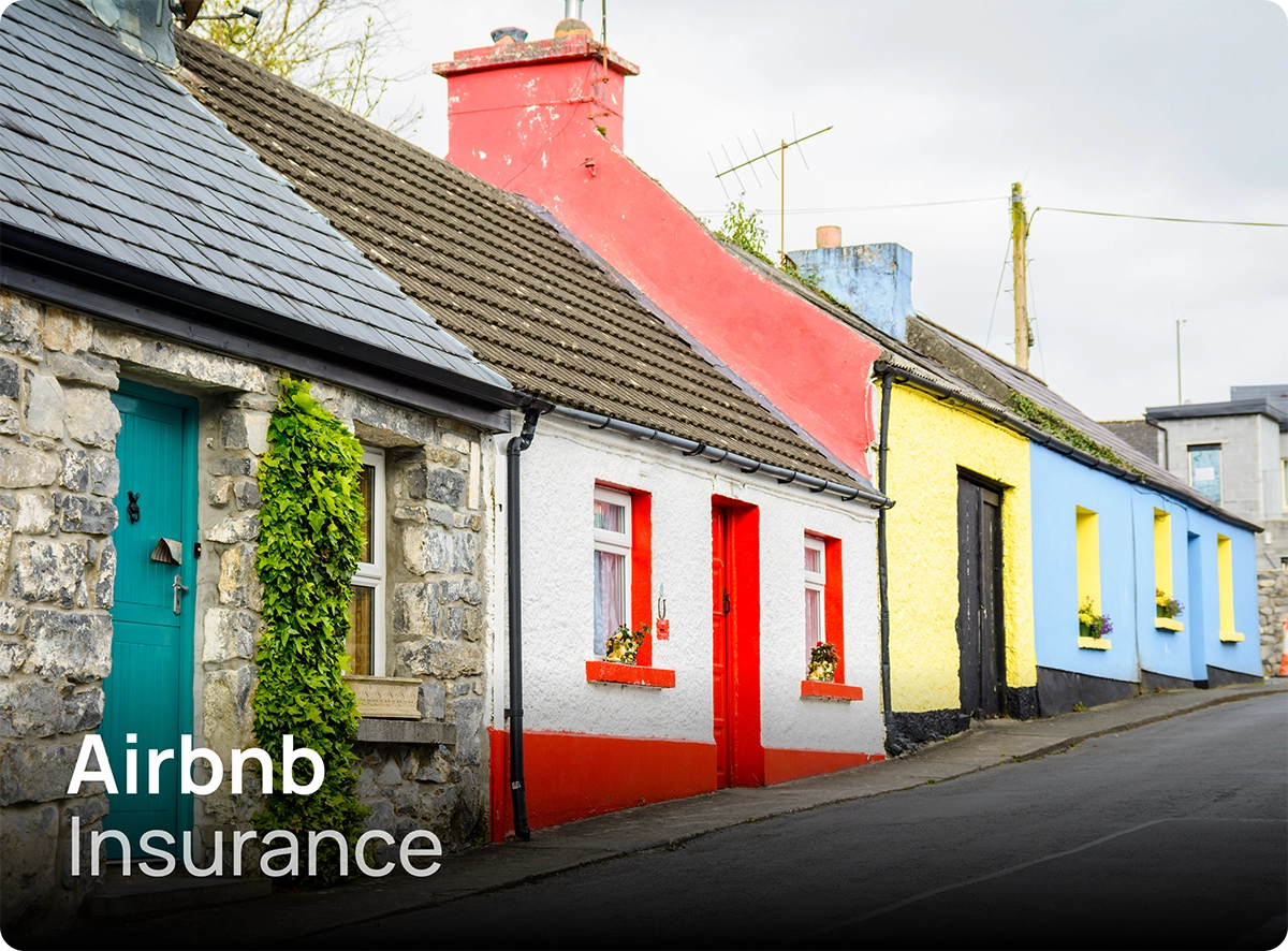 A line of traditional Irish terraced homes in Cong, typical of cottages which are often rented out as short-term rentals requiring Airbnb insurance.